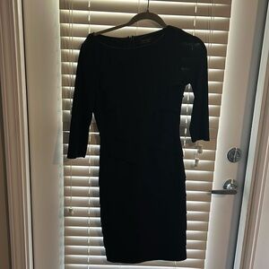 Beautiful lined black dress by White House black market in size 4.